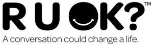 Text "RUOK?" with a smiley face as the letter "O" and caption "A conversation could change a life." underneath.